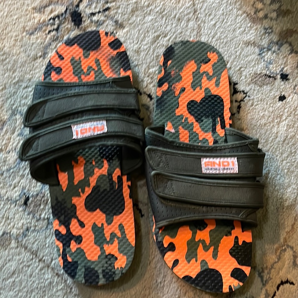 ANDI. Men’s Size 12 Basketball Slides. Camouflage with Velcro adjustable straps.